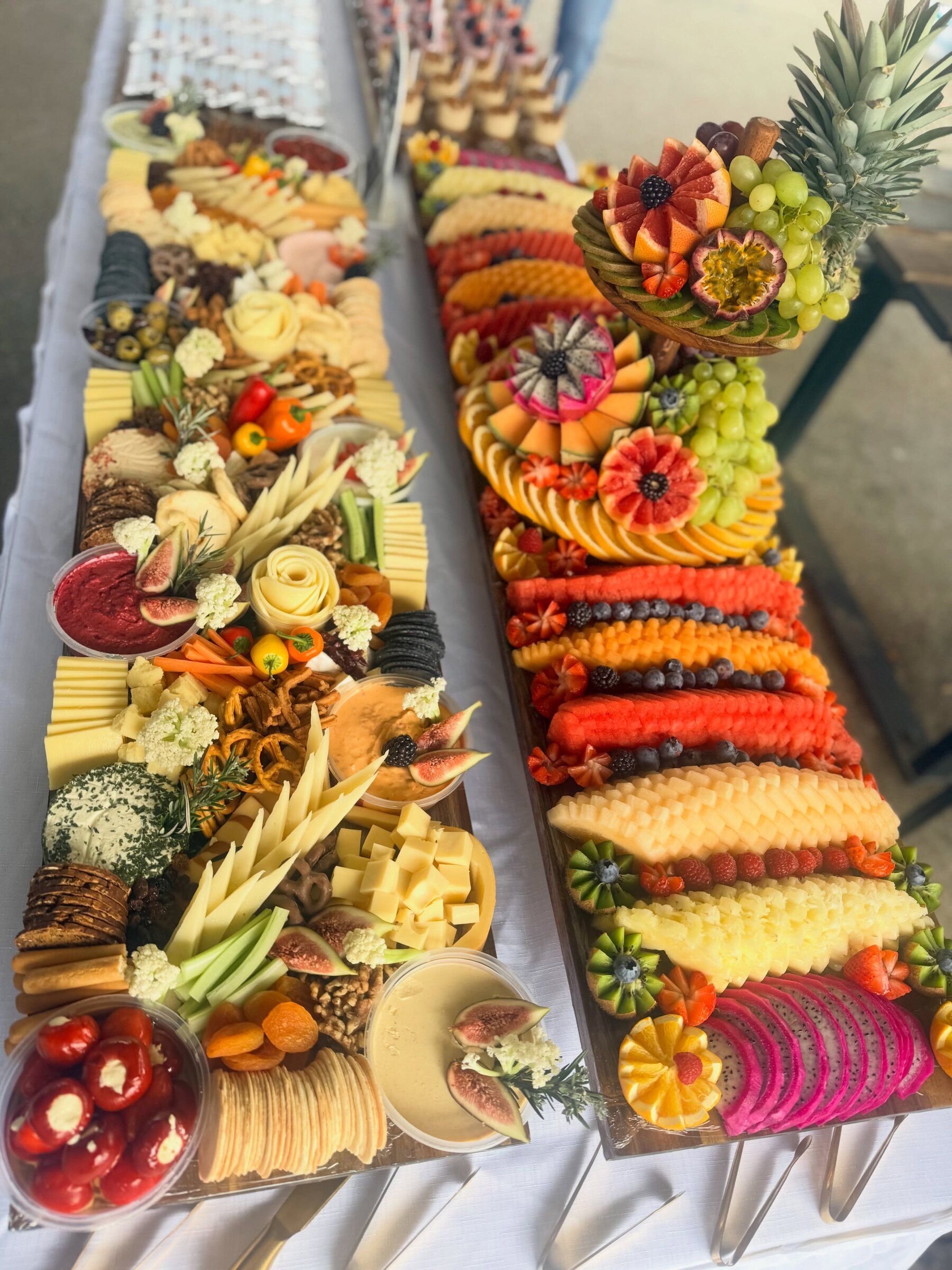 The Classic Package: a fruit board with tier beside a deluxe cheese board